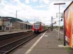 425 089 als RE Frankfurt (Main) Hbf - Treysa bei der Ausfahrt aus Marburg (Lahn).
