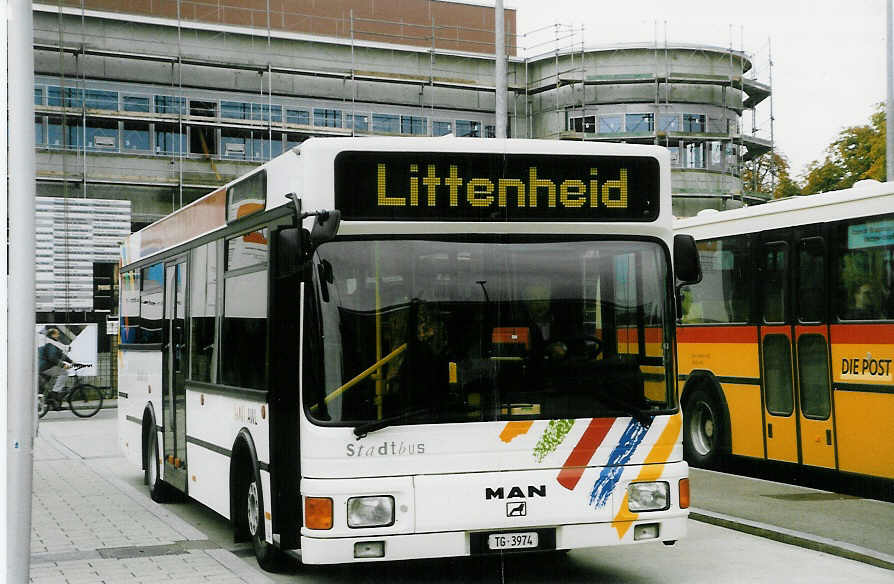 (027'023) - AWL Littenheid - TG 3974 - MAN/Lauber am 8. Oktober 1998 beim Bahnhof Wil