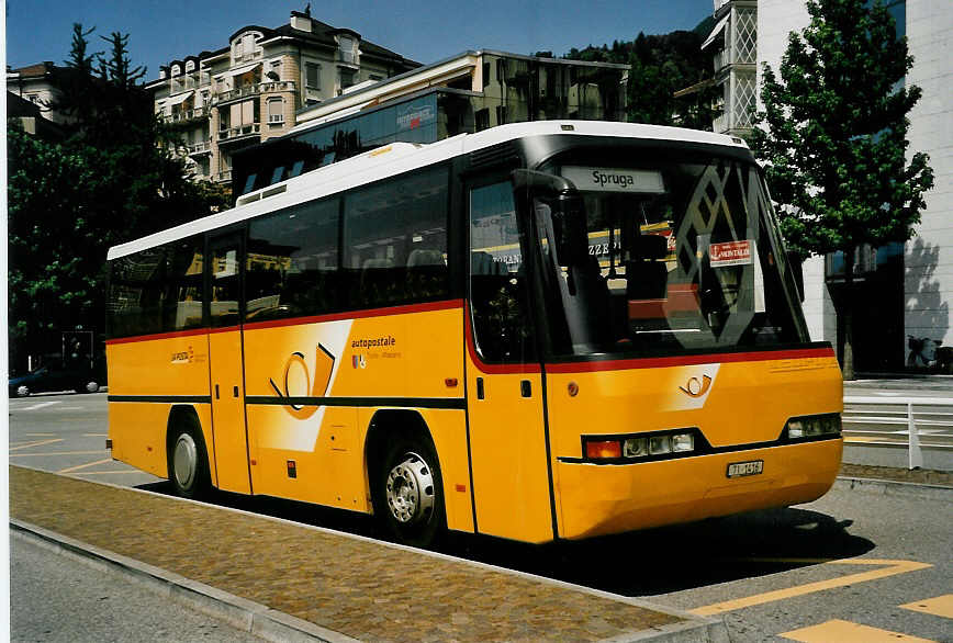 (054'817) - Starnini, Tenero - TI 1416 - Neoplan am 23. Juli 2002 beim Bahnhof Locarno