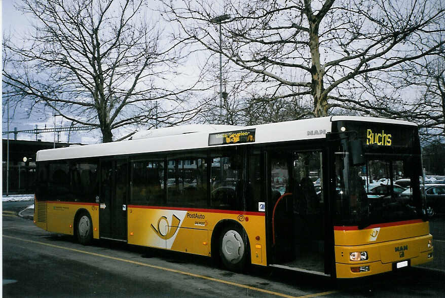 (065'109) - Schett, Sargans - SG 127'861 - MAN am 1. Januar 2004 beim Bahnhof Sargans