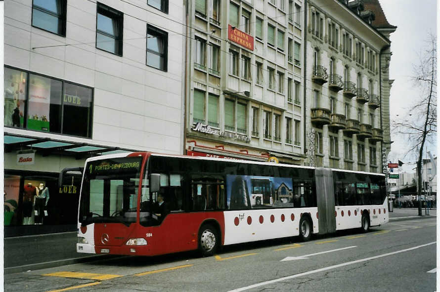 (066'112) - TPF Fribourg - Nr. 584/FR 300'392 - Mercedes am 21. Mrz 2004 beim Bahnhof Fribourg