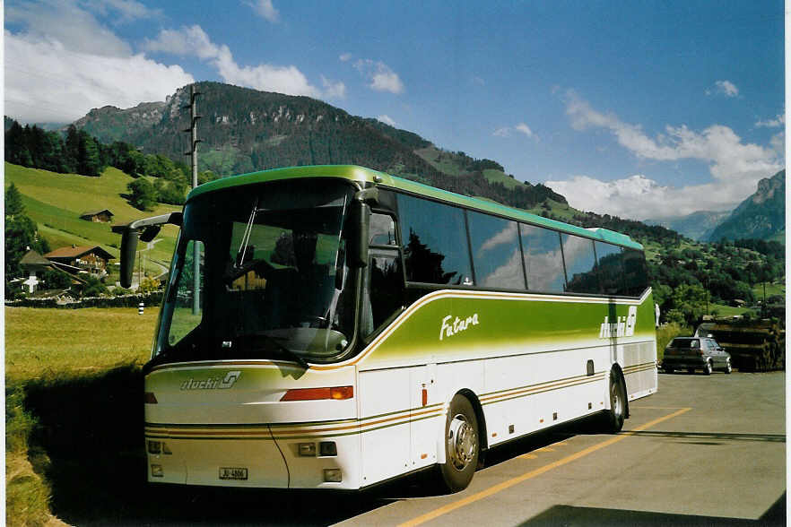 (068'813) - Stucki, Porrentruy - JU 4806 - Bova am 3. Juli 2004 beim Bahnhof Mlenen