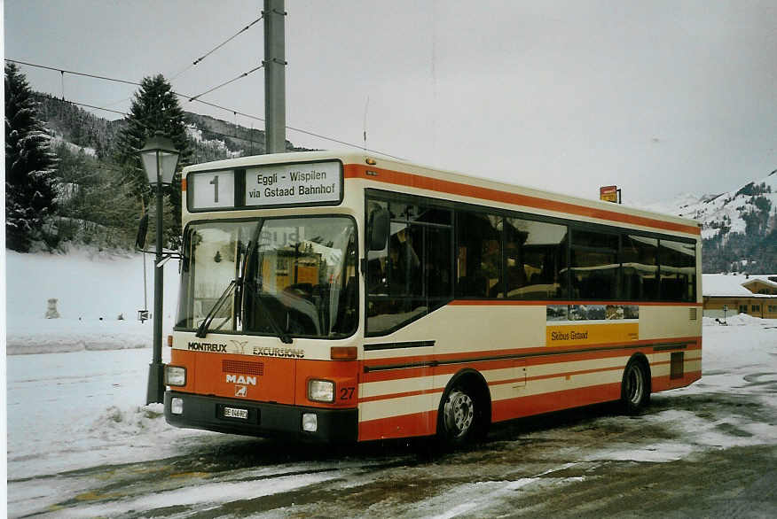 (083'134) - MOB Montreux - Nr. 27/BE 146'921 - MAN (ex BSF Hochdorf) am 19. Februar 2006 beim Bahnhof Gstaad