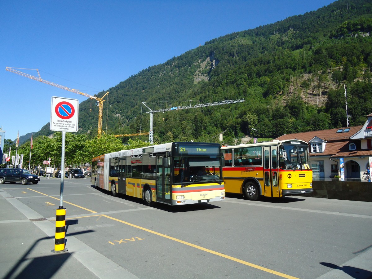 (134'666) - STI Thun - Nr. 107/BE 521'107 - MAN am 3. Juli 2011 beim Bahnhof Interlaken West