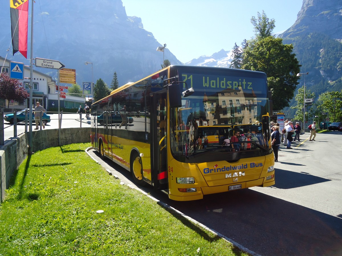 (134'675) - AVG Grindelwald - Nr. 24/BE 364'408 - MAN/Gppel am 3. Juli 2011 beim Bahnhof Grindelwald