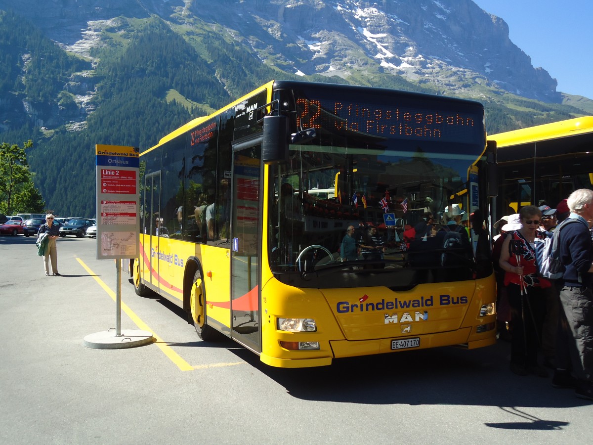 (134'678) - AVG Grindelwald - Nr. 13/BE 407'170 - MAN/Gppel am 3. Juli 2011 beim Bahnhof Grindelwald