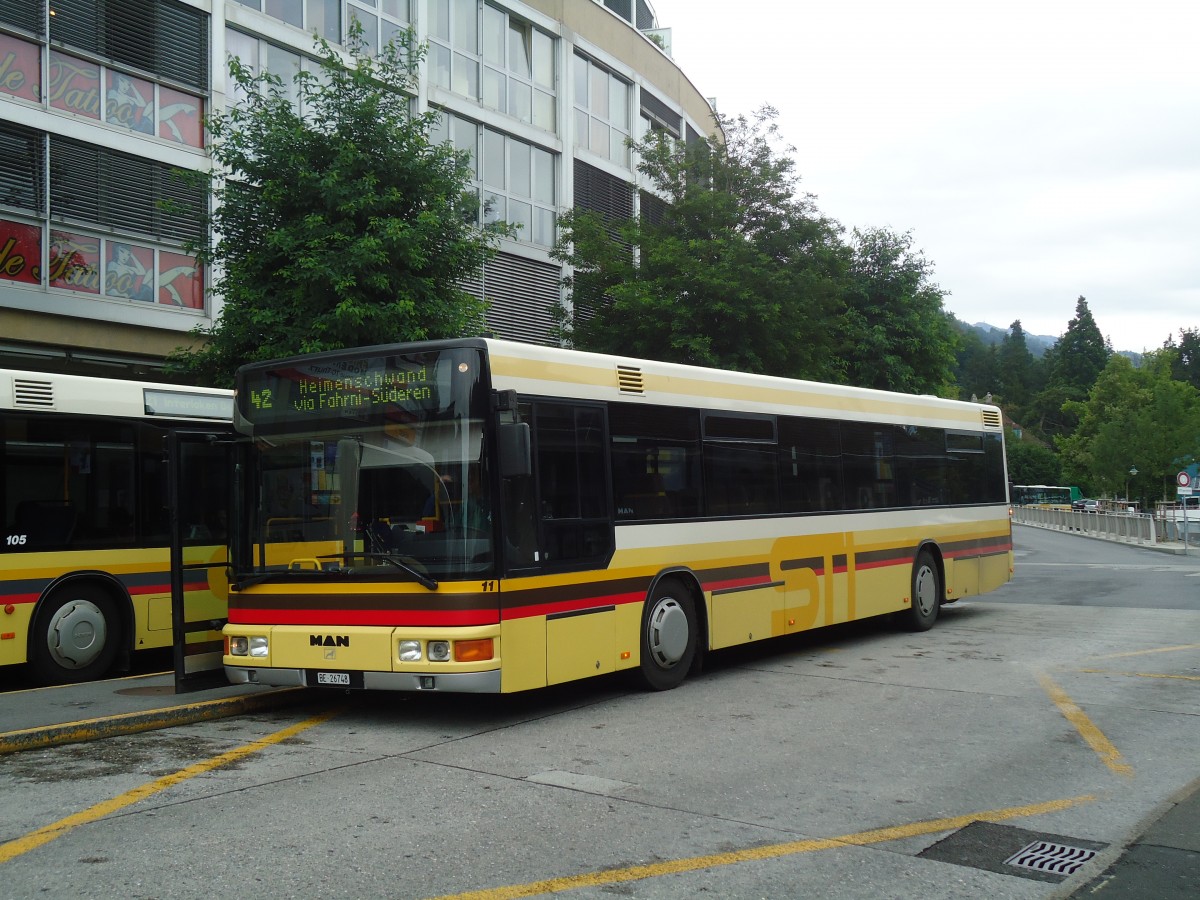 (135'193) - STI Thun - Nr. 11/BE 26'748 - MAN (ex TSG Blumenstein Nr. 2) am 21. Juli 2011 beim Bahnhof Thun