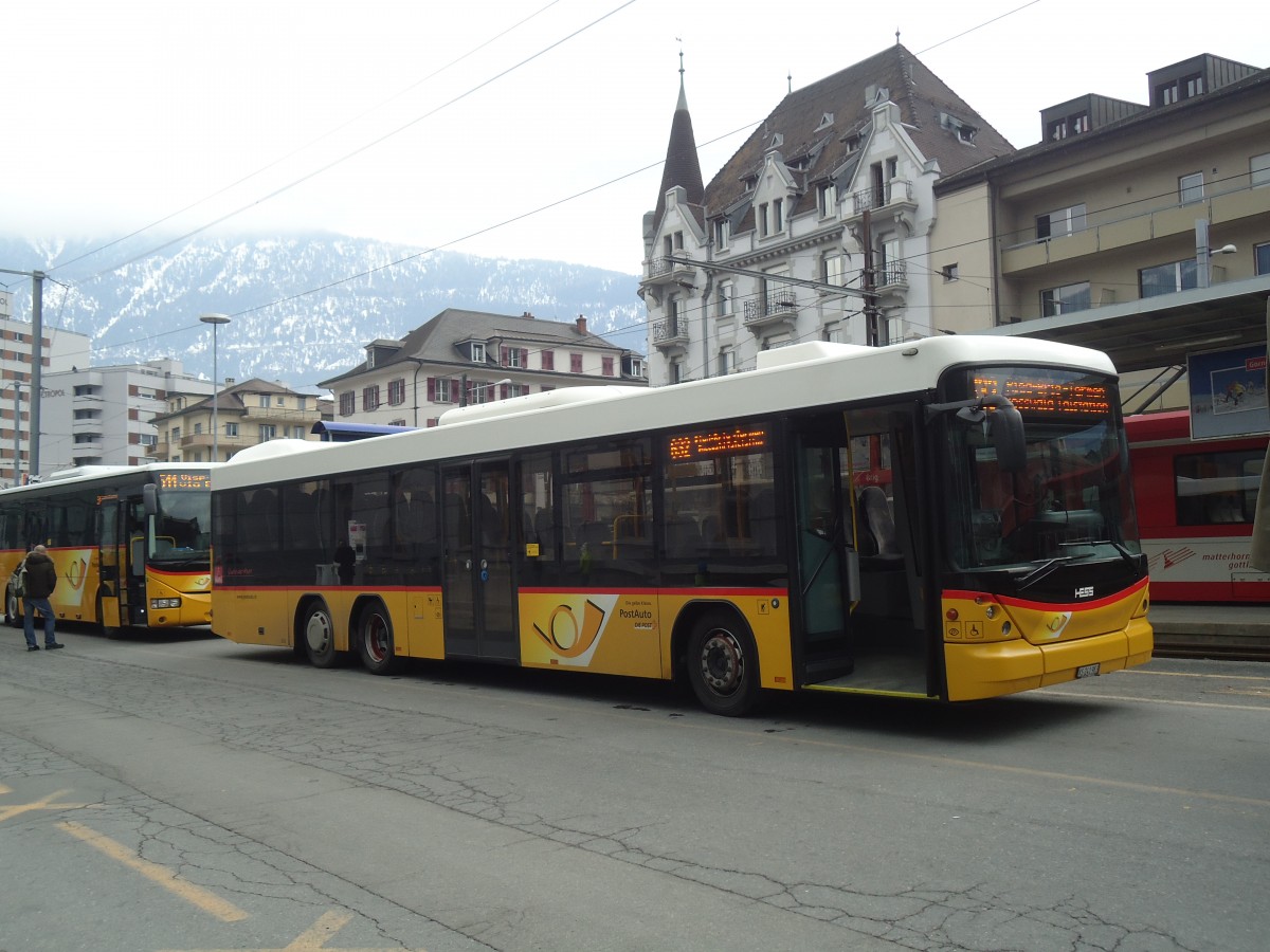 (137'794) - PostAuto Wallis - VS 241'983 - Scania/Hess am 19. Februar 2012 beim Bahnhof Brig