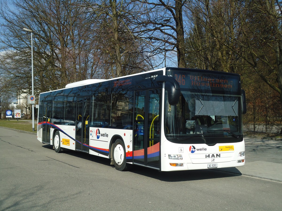 (138'068) - Geissmann, Hgglingen - AG 8283 - MAN am 6. Mrz 2012 beim Bahnhof Wohlen