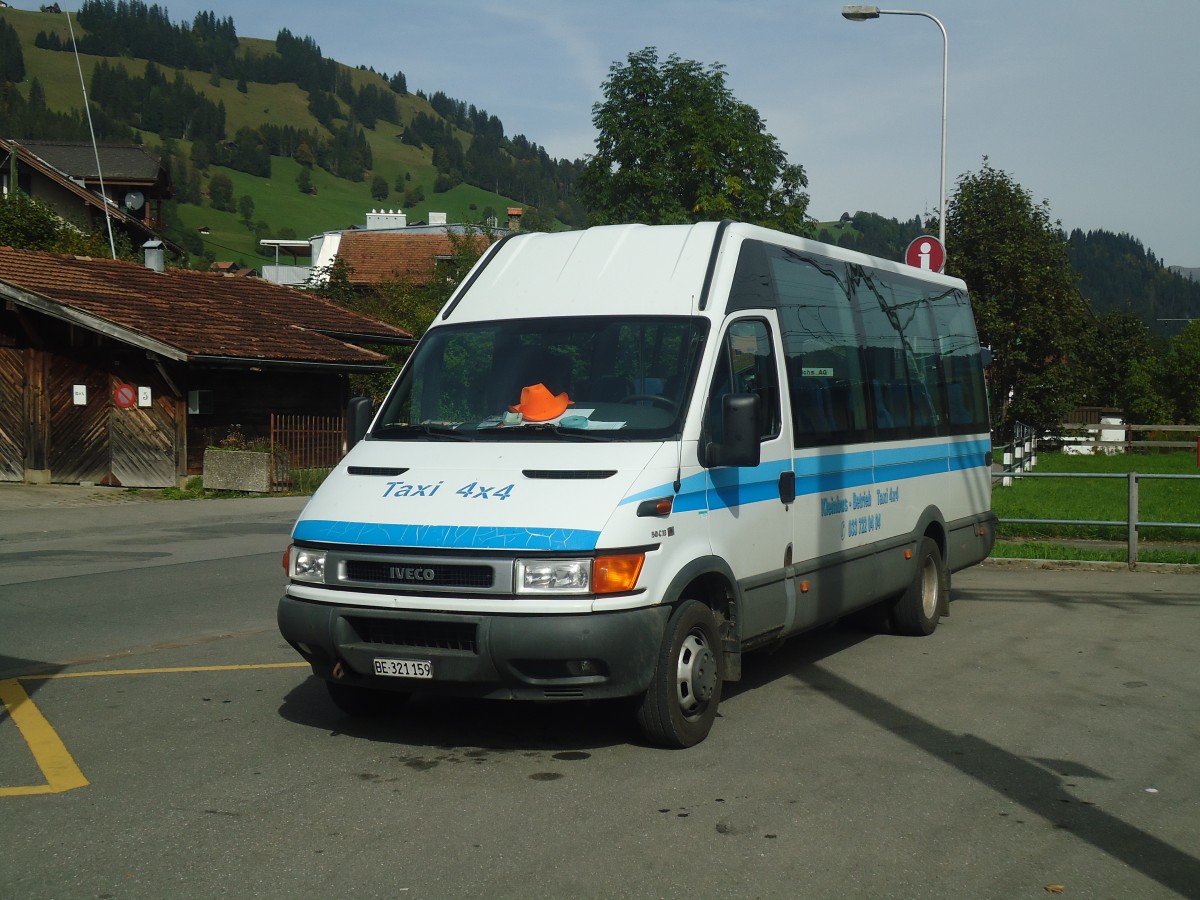 (147'377) - Ueltschi, Zweisimmen - BE 321'159 - Iveco am 28. September 2013 beim Bahnhof Zweisimmen