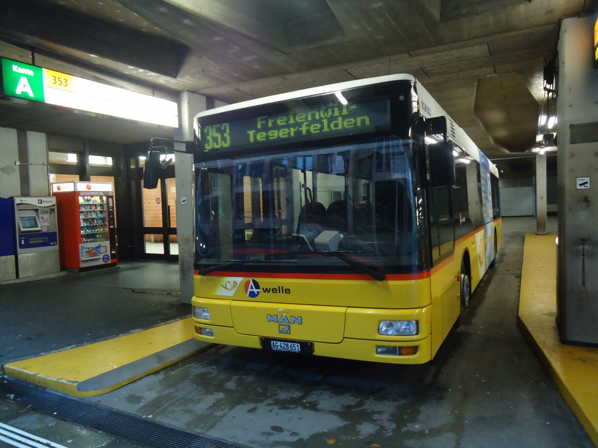 (148'453) - PostAuto Nordschweiz - AG 428'651 - MAN am 26. Dezember 2013 in Baden, Postautostation