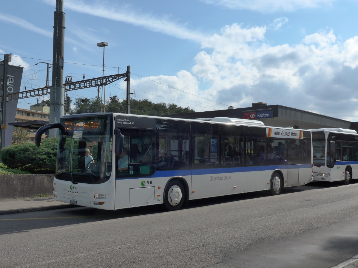 (154'366) - Maag, Kloten - Nr. 30/ZH 590'930 - MAN am 21. August 2014 beim Bahnhof Kloten