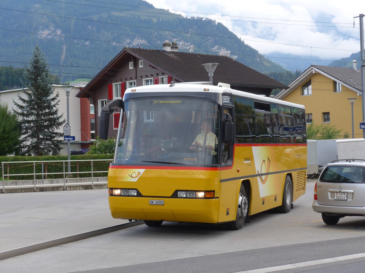 (154'663) - Dillier, Sarnen - Nr. 12/OW 10'209 - Neoplan am 30. August 2014 beim Bahnhof Sarnen