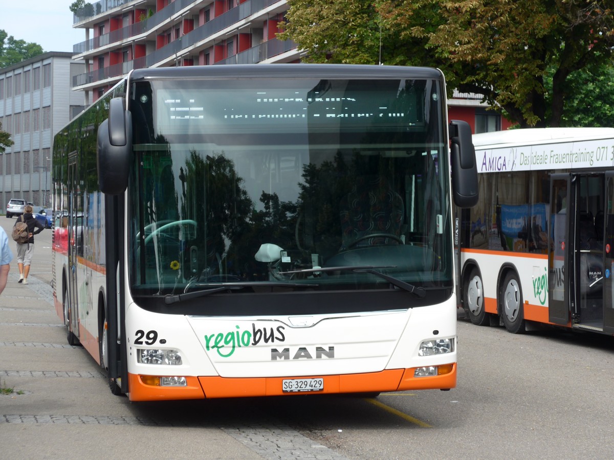 (163'205) - Regiobus, Gossau - Nr. 29/SG 329'429 - MAN am 2. August 2015 beim Bahnhof Gossau