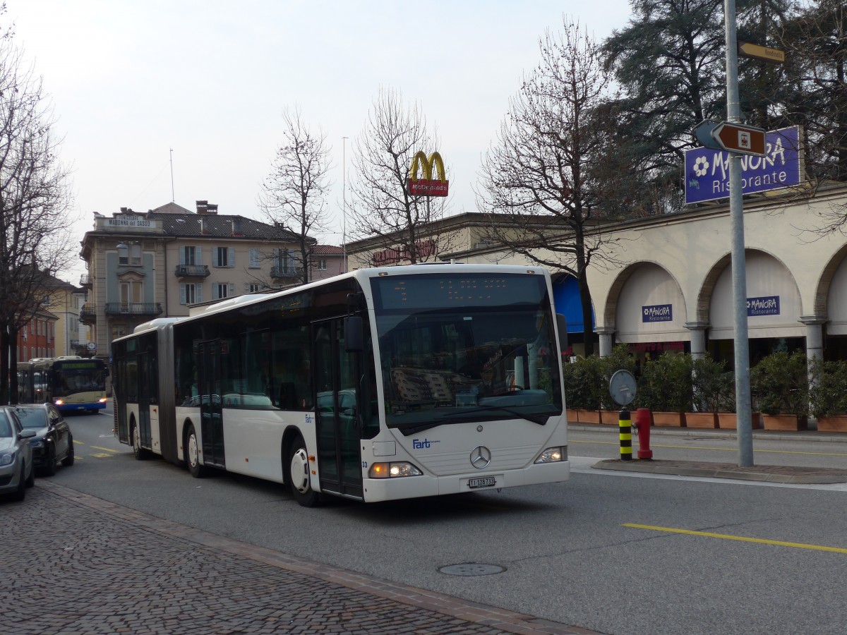 (168'608) - FART Locarno - Nr. 33/TI 128'733 - Mercedes (ex SBC Chur Nr. 92; ex ARL Viganello Nr. 23; ex TPL Lugano Nr. 29) am 6. Februar 2016 beim Bahnhof Locarno