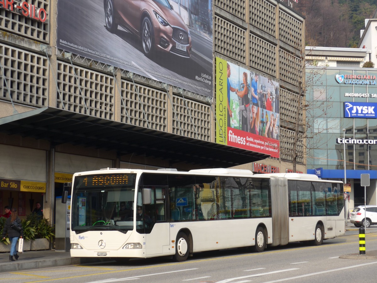 (168'628) - FART Locarno - Nr. 33/TI 128'733 - Mercedes (ex SBC Chur Nr. 92; ex ARL Viganello Nr. 23; ex TPL Lugano Nr. 29) am 6. Februar 2016 beim Bahnhof Locarno