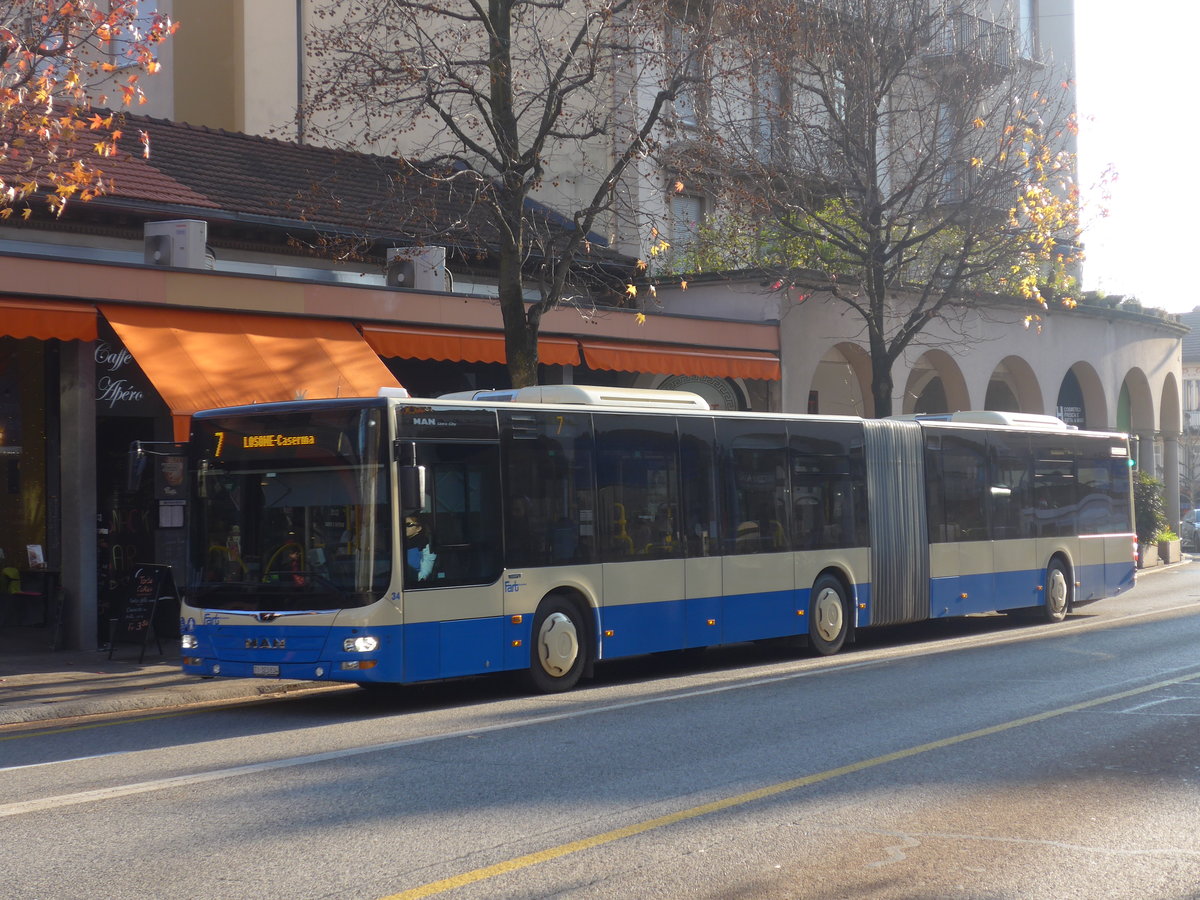 (199'773) - FART Locarno - Nr. 34/TI 323'834 - MAN am 7. Dezember 2018 beim Bahnhof Locarno