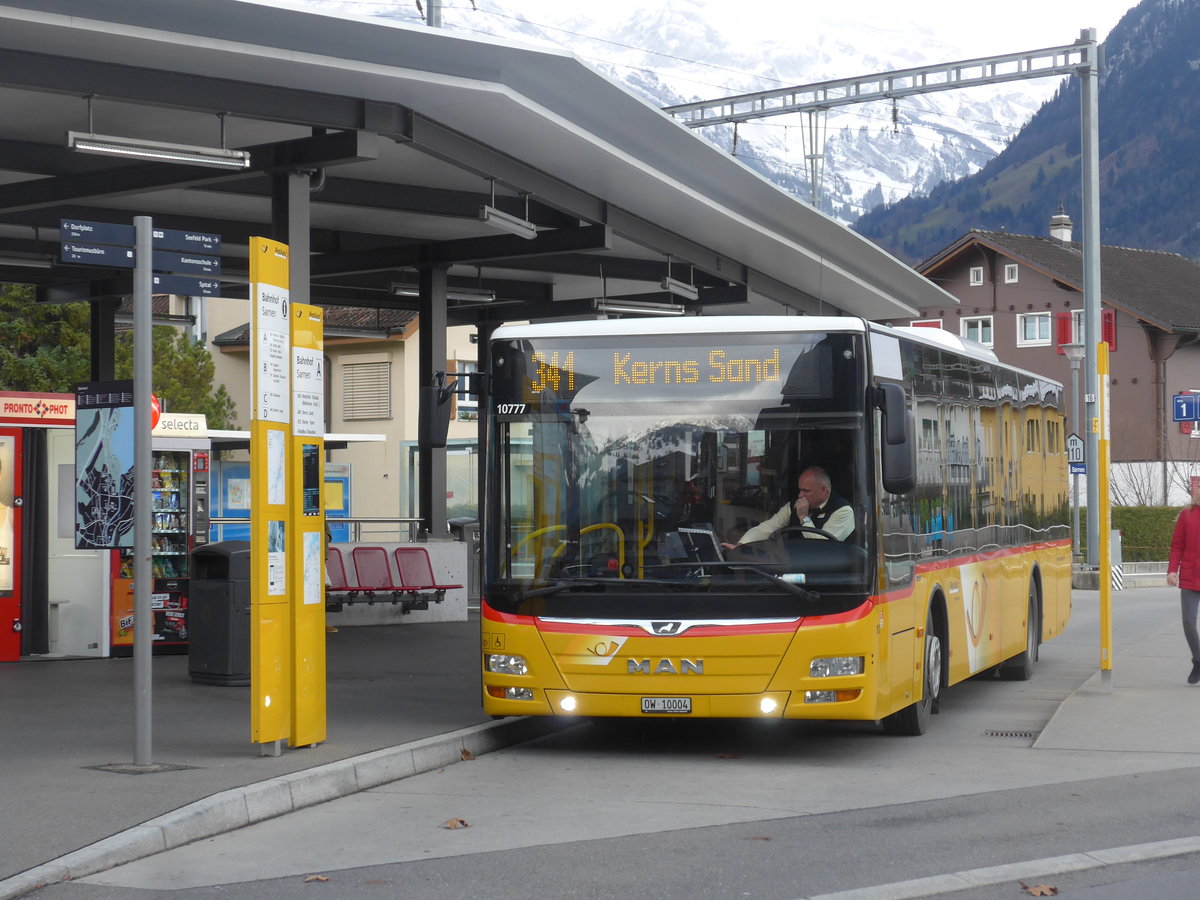 (199'847) - Dillier, Sarnen - Nr. 10/OW 10'004 - MAN am 8. Dezember 2018 beim Bahnhof Sarnen