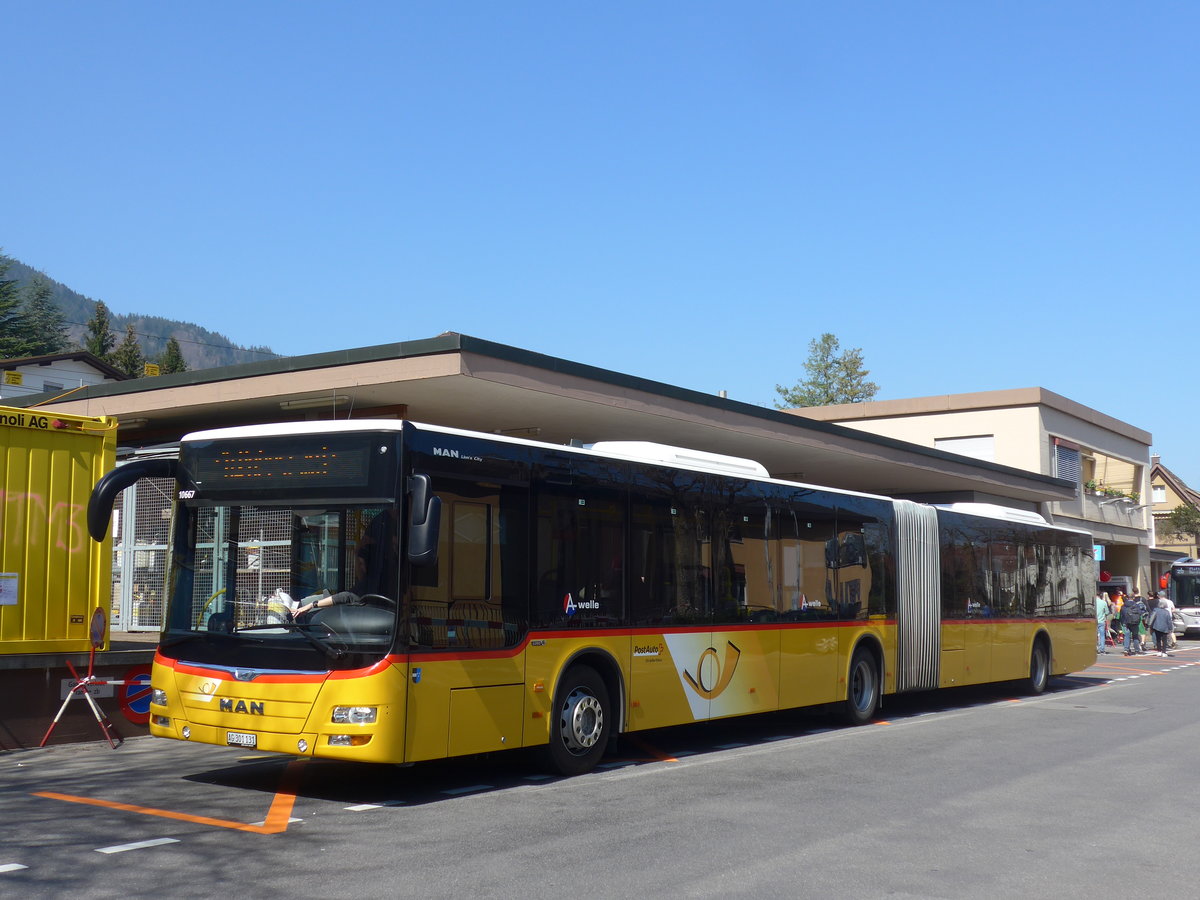 (203'327) - PostAuto Nordschweiz - AG 301'131 - MAN am 30. Mrz 2019 beim Bahnhof Hergiswil