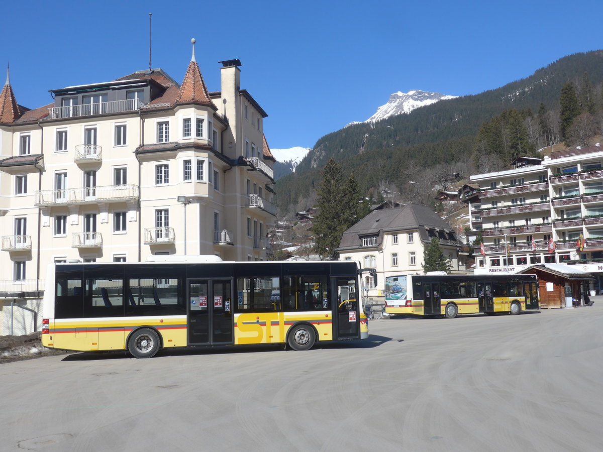 (223'864) - Grindelwaldbus, Grindelwald - Nr. 17/BE 72'444 - MAN/Gppel (ex STI Thun Nr. 133) + STI Thun - Nr. 129/BE 800'129 - MAN am 28. Februar 2021 beim Bahnhof Grindelwald (Einsatz Grindelwaldbus