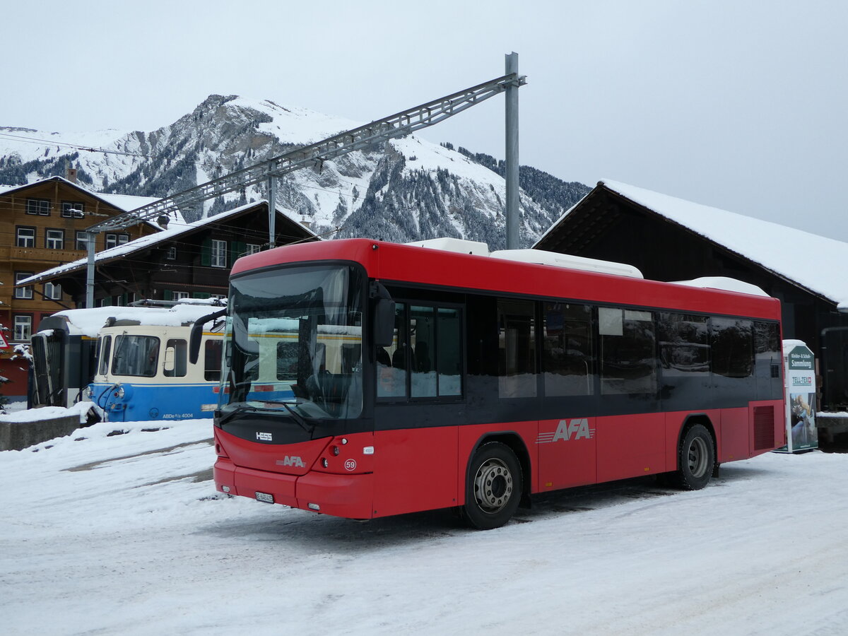 (243'842) - AFA Adelboden - Nr. 59/BE 645'415 - Scania/Hess am 13. Dezember 2022 beim Bahnhof Lenk