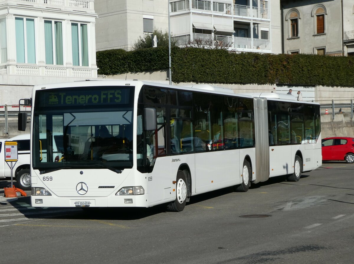 (245'954) - Intertours, Domdidier - Nr. 659/FR 300'659 - Mercedes (ex Nr. 205; ex VZO Grningen Nr. 29) am 7. Februar 2023 beim Bahnhof Locarno