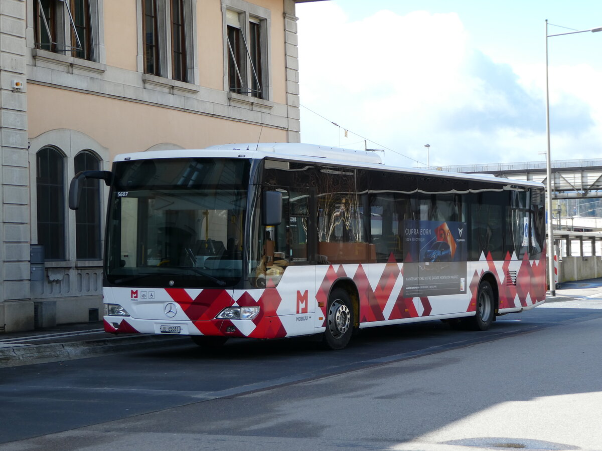 (247'606) - CarPostal Ouest - JU 65'081/PID 5607 - Mercedes (ex Nr. 14) am 25. Mrz 2023 beim Bahnhof Delmont