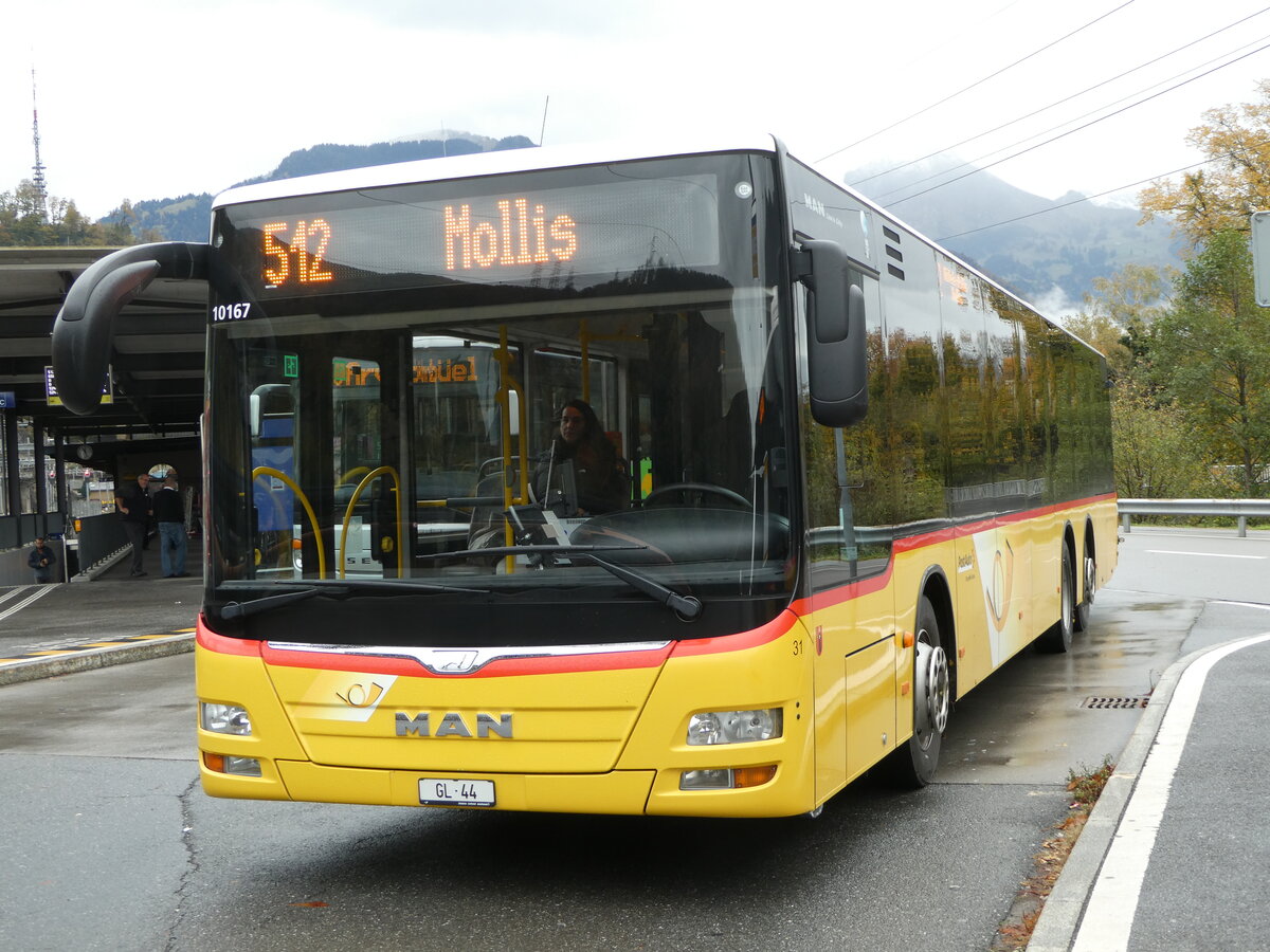 (256'565) - Niederer, Filzbach - Nr. 31/GL 44/PID 10'167 - MAN (ex Schwizer, Goldach; ex Casutt, Gossau) am 31. Oktober 2023 beim Bahnhof Ziegelbrcke