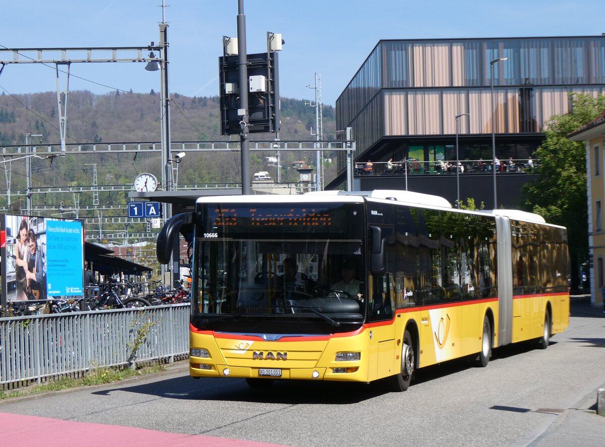 (261'149) - PostAuto Nordschweiz - AG 301'051/PID 10'666 - MAN am 12. April 2024 beim Bahnhof Baden